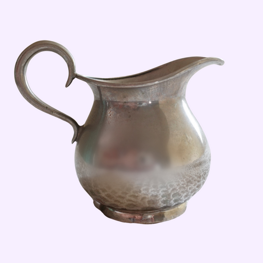 small silver water pitcher