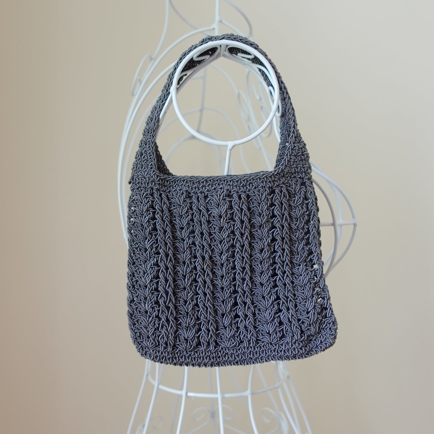 small gray woven bag