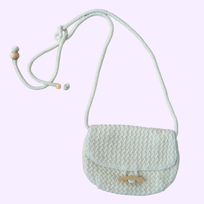 cream woven bag with button clasp