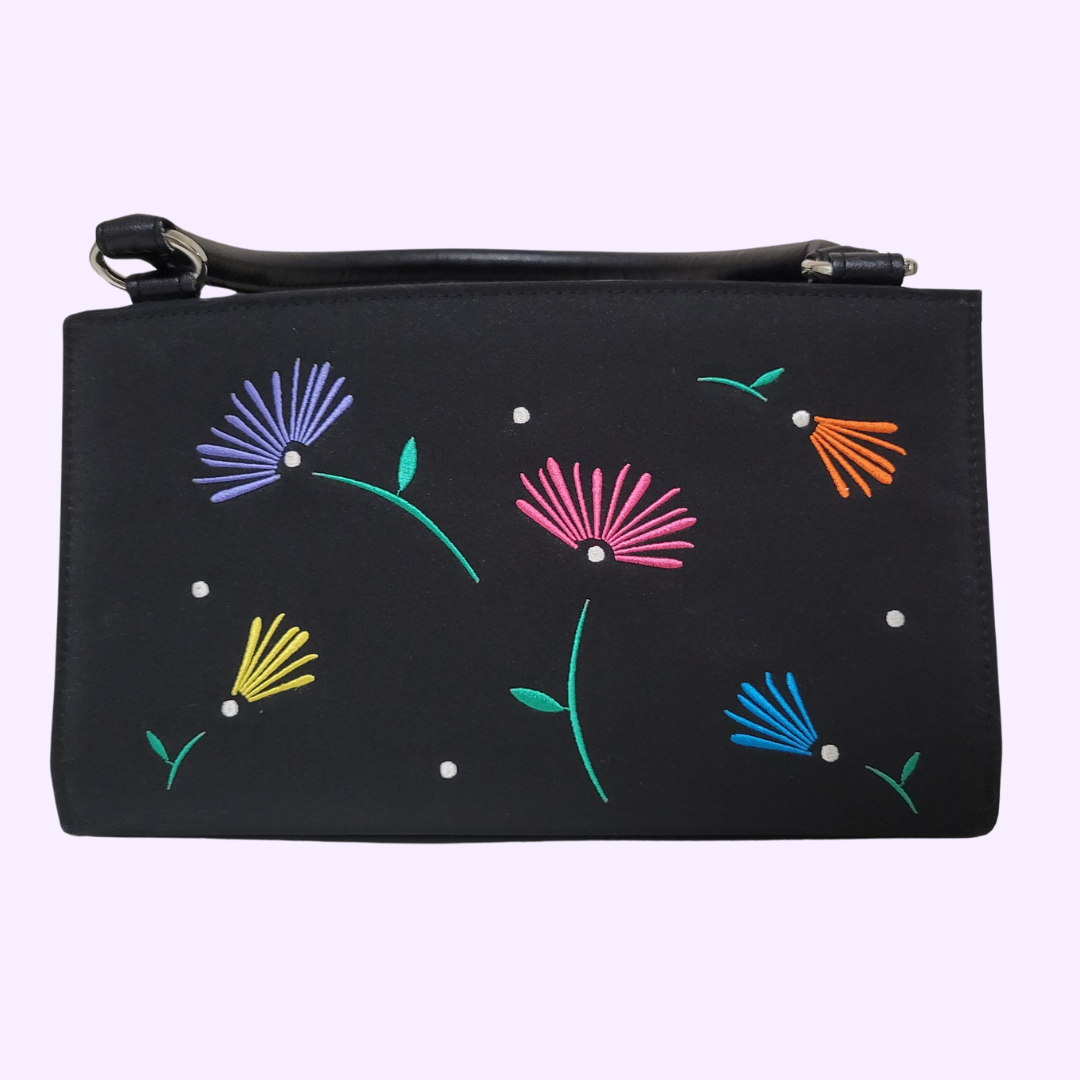 black purse with colorful embroidered flowers