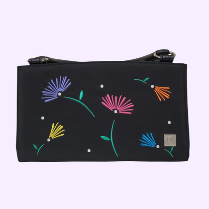 black purse with colorful embroidered flowers