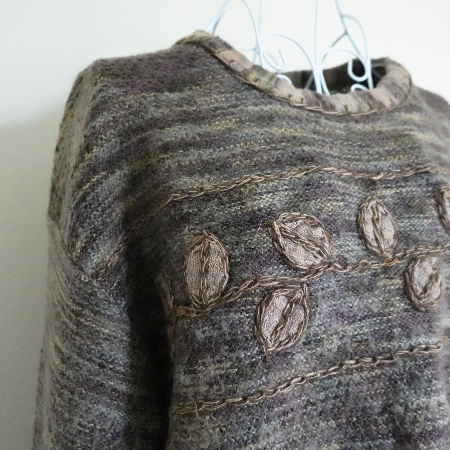brown and green leaf design sweater